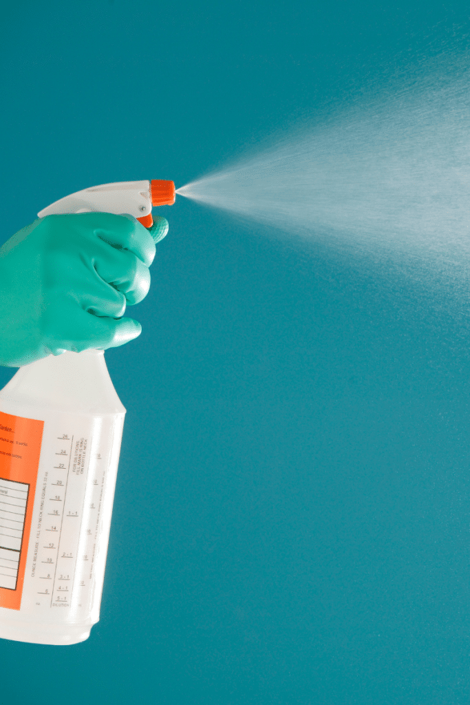 Spraying a cleaning spray